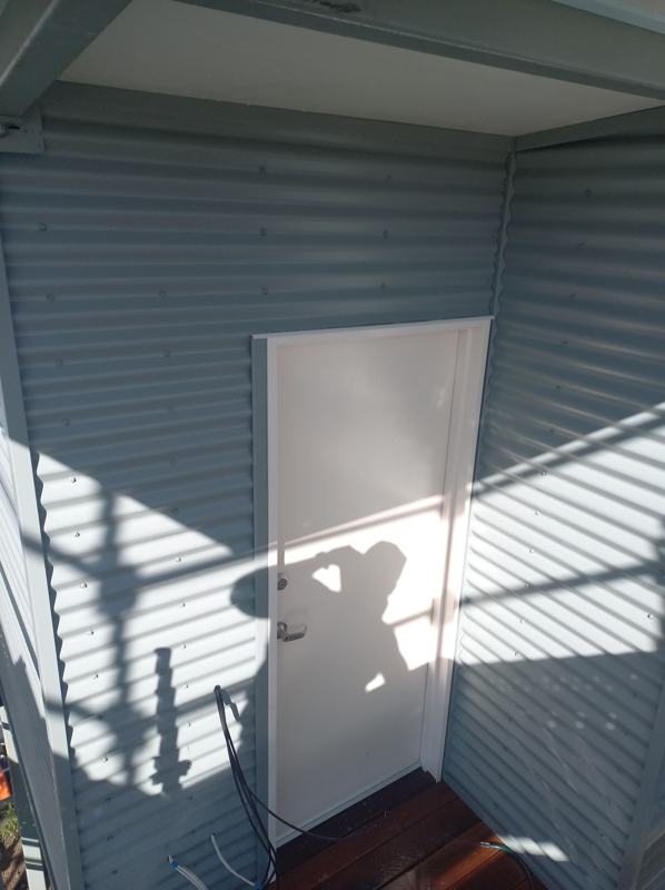 Wall cladding finished around a doorway