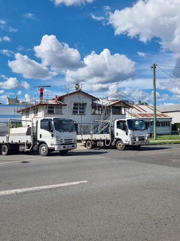 Jaymac trucks outside a Queenslander reroof